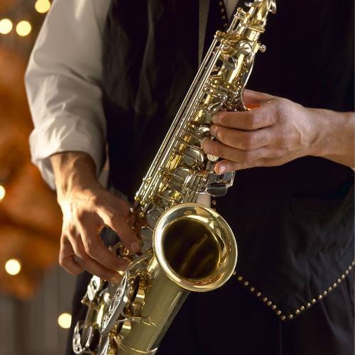 Close-up of hands playing an alto saxophone during a private lesson in Dubai, representing beginner saxophone classes in the UAE.